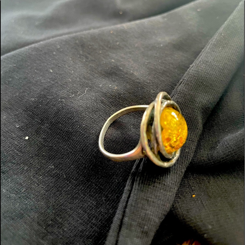Green / gold tone encircled with silver circles.